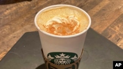 A Pumpkin Spice Latte drink rests on a table at a Starbucks in New York, Aug. 24, 2023. 