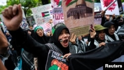 People participate in a pro-Palestinian rally in front of the Israeli Embassy in Bangkok, Oct. 21, 2023. 