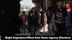 FILE - Iranian women walk on a street amid the implementation of new hijab-related surveillance in Tehran, Iran, April 15, 2023. (West Asia News Agency via Reuters)