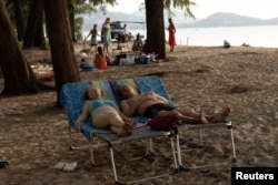FILE - Russian tourists relax in Phuket, Thailand, Dec. 25, 2022.