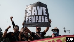 Members of the Muslim community protest against a government plan to develop Rempang island into a Chinese-funded economic zone that would displace around 7,500 people in front of the Arjuna Wijaya Statue in Jakarta, Indonesia, on Sept. 20, 2023.