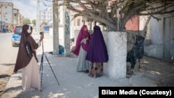 FILE - Journalists from the Somali women-led newsroom Bilan are seen on assignment. (UNDP/2022/Said Fadhaye)