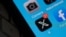 FILE - The X logo is seen on a smartphone screen July 31, 2023. New research shows that X, formerly Twitter, has seen an uptick in pro-Russian narratives among Spanish-language users in Latin America.