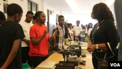 FILE - Students at Malawi University of Science and Technology discuss artificial intelligence products, in this undated photo. Students and programs at universities across Malawi are feeling the impact of the recent USAID funding freeze. (Lameck Masina/VOA)