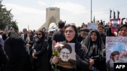 Mourners attend the funeral of Iran's President Ebrahim Raisi at Azadi square in Tehran on May 22, 2024. (AFP)