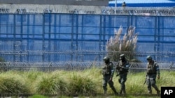 Soldiers patrol outside prison in Cotopaxi, Ecuador, Jan. 14, 2024.
