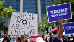 People rally outside the Wilkie D. Ferguson Jr. US Courthouse, June 13, 2023, in Miami.