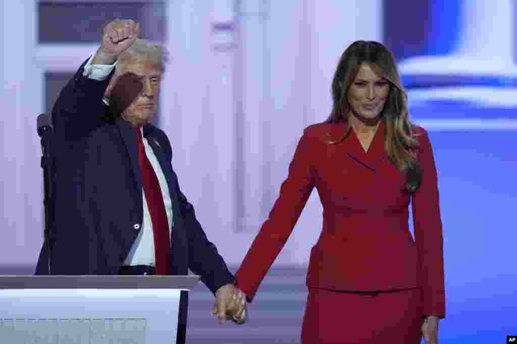 Republican presidential candidate former President Donald Trump is joined on stage by his wife Melania Trump at the Republican National Convention, July 18, 2024, in Milwaukee.
