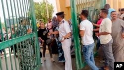 Evacuees cross into Egypt through the Argeen land port, after being evacuated from Sudan to escape the conflict, April 27, 2023.