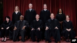 FILE - U.S. Supreme Court justices, bottom row, from left, Sonia Sotomayor, Clarence Thomas, Chief Justice John Roberts, Samuel Alito, and Elena Kagan. Top row, from left, Amy Coney Barrett, Neil Gorsuch, Brett Kavanaugh, and Ketanji Brown Jackson, Oct. 7, 2022. 