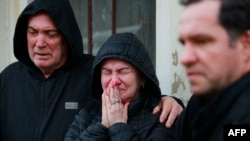 Relatives mourn during the funeral of a victim of a cyclone that hit Mucum, Rio Grande do Sul, Brazil, during his funeral in the city's cemetery, on Sept. 9, 2023. 