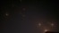 This video grab from AFPTV taken on April 14, 2024 shows explosions lighting up the sky in Hebron in the Israeli-occupied West Bank during an Iranian attack on Israel. 