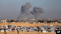 FILE - Smoke rises following an Israeli airstrike east of Rafah, Gaza Strip, May 6, 2024. 