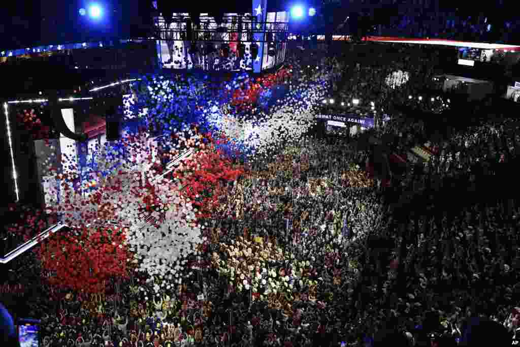 Republican presidential candidate and former president Donald Trump and vice presidential candidate Sen. J.D. Vance, watch with their families as the balloons fall during the final day of the Republican National Convention, July 18, 2024, in Milwaukee.