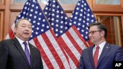 House Speaker Mike Johnson greets Alexander Yui, Taiwan's representative to the US, before a meeting on Capitol Hill, Jan. 9, 2024, in Washington. (AP Photo/Mariam Zuhaib)