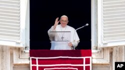 Pope Francis delivers his blessing as he recites the Angelus noon prayer from the window of his studio overlooking St. Peter's Square at the Vatican, June 18, 2023.