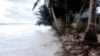 FILE - Waves surge over the beck and onto the island during a king tide event on Kili in the Marshall Islands, Jan. 21, 2015. (Bikini Atoll Local Government) 