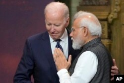 FILE - U.S. President Joe Biden, left, and India Prime Minister Narendra Modi talks during the G20 leaders summit in Nusa Dua, Bali, Indonesia, Nov. 15, 2022. Biden is honoring Modi with a state visit this week. Modi arrives in the U.S. on Wednesday.