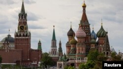 FILE - A general view on the Spasskaya tower of the Kremlin and St. Basil's Cathedral in Moscow, May 16, 2024. 