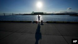 An angler fishes at Onahama Port in Iwaki, northeastern Japan, 68 kilometers from the Fukushima Daiichi nuclear power plant, damaged by a massive March 11, 2011, earthquake and tsunami, on Aug. 25, 2023. 