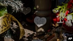 A makeshift memorial is set up at the scene where Russian forces struck a restaurant in June with an Iskander missile, killing 13 people and reducing the building to rubble, in Kramatorsk, Ukraine, Sept. 13, 2023.