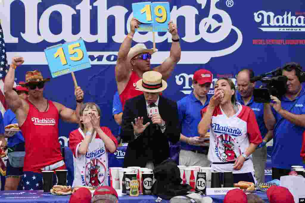 Miki Sudo, right, and Mayoi Ebihara, left, compete in the women's division of Nathan's Famous Fourth of July hot dog eating contest at Coney Island in the Brooklyn borough of New York.&nbsp;Sudo won by eating a record 51 hot dogs.&nbsp;