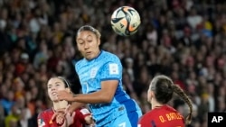 England's Lauren James, center, heads the ball ahead of Spain's Mariona Caldentey, left, and Spain's Ona Batlle during the Women's World Cup soccer final between Spain and England at Stadium Australia in Sydney, Aug. 20, 2023.