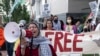 FILE - Jawahir Kamal leads pro-Palestinian demonstrators in a chant as they gather before a presidential debate between U.S. President Joe Biden and former President Donald Trump in Atlanta, Georgia, on June 27, 2024.