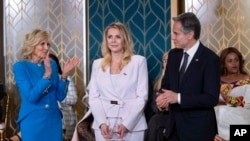 Polish journalist Bianka Zalewska, center, receives the International Women of Courage Award from U.S. first lady Jill Biden, left, and U.S. Secretary of State Antony Blinken to commemorate International Women's Day at the White House in Washington, March 8, 2023.