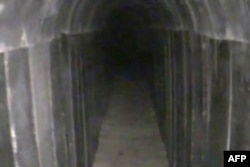 FILE - This image from video released by the Israeli army Aug. 15, 2022, reportedly shows a tunnel leading out of the Gaza Strip into Israel, dug by the Palestinian enclave's Hamas rulers, which the army said it had discovered and blocked.