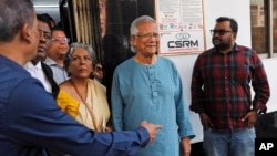 Nobel laureate Muhammad Yunus, center, comes out of a courtroom after he was granted bail in an embezzlement case, in Dhaka, Bangladesh, Mar. 03, 2024.