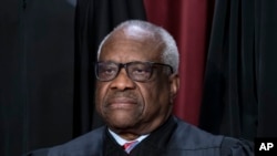 FILE - Associate Justice Clarence Thomas at the Supreme Court building in Washington, Oct. 7, 2022. An investigation by Democratic senators of the court's ethics details Thomas' luxury travel and urges Congress to establish a way to enforce a new code of conduct. 