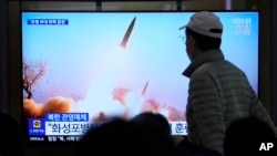 A TV news program on March 10, 2023, shows an image of a North Korean missile launch, at the Seoul Railway Station in South Korea. North Korean leader Kim Jong Un supervised an artillery drill simulating an attack on the South, state media said Friday.