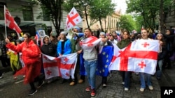 Demonstrators rally against the "foreign influence" bill in Tbilisi, Georgia, May 14, 2024. Critics see the bill, similar to a restrictive Russian law, as a threat to democratic freedoms and the country's aspirations to join the European Union.