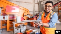 We Recycle Solar Chief Executive Officer Adam Saghei shows metals removed from solar panels to be recycled at the We Recycle Solar plant in Yuma, Arizona, Dec. 6, 2023.