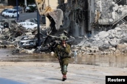 FILE - A view of a junction in the Sderot area, southern Israel, shows the aftermath of a mass-infiltration by Hamas gunmen from the Gaza Strip, Oct. 7, 2023.