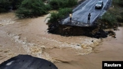 FILE - A drone view shows a broken bridge, after Cyclone Biparjoy made landfall, along the Naliya-Bhuj highway, in the western state of Gujarat, India, on June 16, 2023.