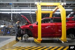 Workers assemble a car at a Vinfast factory in Hai Phong, Vietnam, on Sept. 29, 2023.