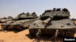 Israeli tanks park near the southern Israel-Gaza border, amid the ongoing conflict between Israel and the Palestinian Islamist group Hamas, in Israel, April 28, 2024. 
