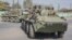 FILE - Zambian Army armored personnel carriers patrol the Chawama Compound in Lusaka on Aug. 3, 2021. Officials in Zimbabwe have alleged the United States is plotting to move its Africa Command to neighboring Zambia from Germany, an accusation the U.S. and Zambia deny.