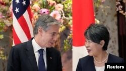 FILE - US Secretary of State Antony Blinken and Japan's Foreign Minister Yoko Kamikawa speak as they wait for group photo session during the G7 Foreign Ministers' Meeting at the Iikura Guest House, Nov. 8, 2023, in Tokyo. 