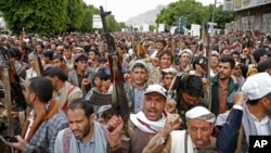 FILE - Houthi supporters chant slogans as they attend a rally marking eight years for a Saudi-led coalition, on March 26, 2023, in Sanaa, Yemen.