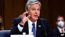 FILE - FBI Director Christopher Wray speaks on Capitol Hill, Sept. 15, 2021.