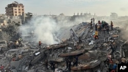 Palestinians look for survivors following Israeli airstrike in Nusseirat refugee camp, Gaza Strip, Oct. 31, 2023. On the same day, U.N. Secretary-General Antonio Guterres said he is "deeply alarmed" by the intensification of the conflict between Israel and Hamas in Gaza.