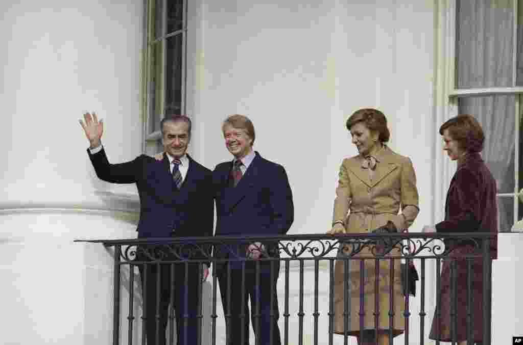 President Jimmy Carter, the Shah of Iran, Empress Farah and Mrs. Roslynn Carter on the balcony at the White House in Washington, Nov. 15, 1977.