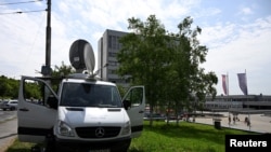 A TV car parks near the F.D. Roosevelt University Hospital, where Slovak Prime Minister Robert Fico is hospitalized following an assassination attempt, in Banska Bystrica, Slovakia, May 21, 2024.