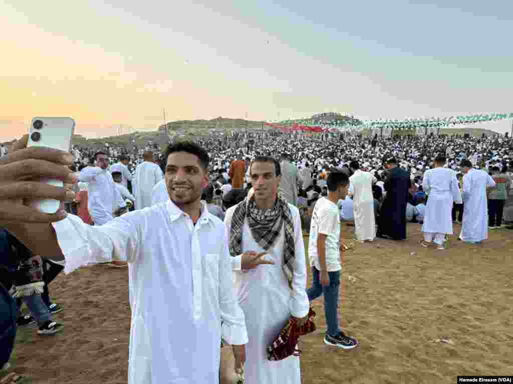 Friends Islam and Osama pose for an Eid selfie to show solidarity with Palestinians. Abusir, Egypt, April 10, 2024.