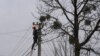 A worker repairs a power line following a Russian strike in the village of Velyka Vilshanytsia, some 50km from Lviv, on March 9, 2023.