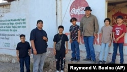 Members of the Pascua Yaqui Tribe pose for a photo in their tribal community in Sonora, Mexico, in March 2023. (Raymond V. Buelna via AP)