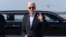 President Joe Biden talks to reporters upon his arrival to Joint Base Andrews, Md., en route to the White House, Aug. 18, 2024. 